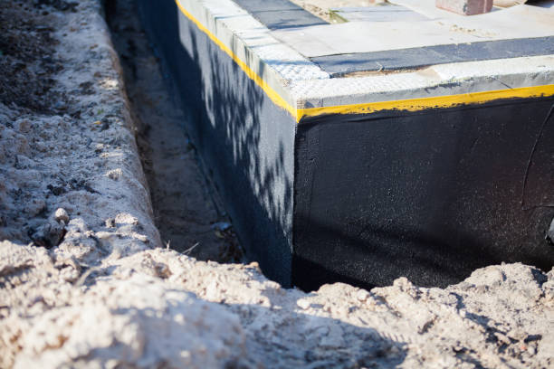 Professional Waterproofing technician working in Hamlet, IN